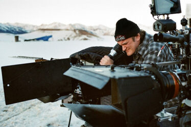 A Camera Man Working With His Professional Camera.