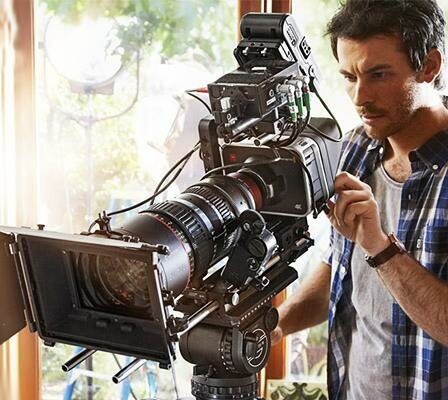 A Camera Man Working With A Professional Film Camera For A Commercial Film.