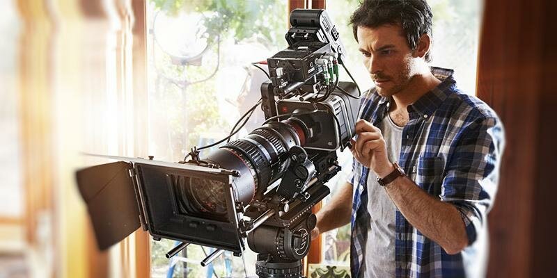 A Camera Man Working With A Professional Film Camera For A Commercial Film.