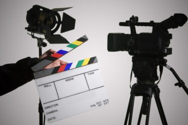 A Person Holding The Movie Clapboard.