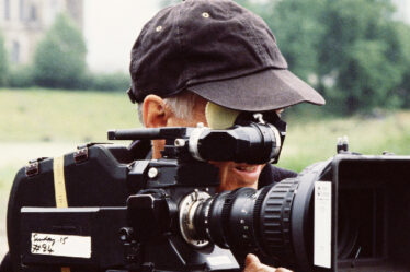 A Movie Camera Man With A Video Camera.