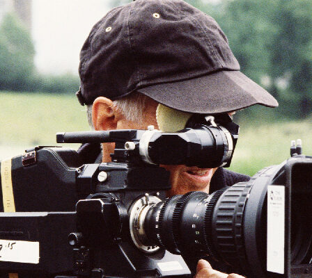 A Movie Camera Man With A Video Camera.