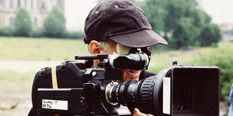 A Movie Camera Man With A Video Camera.