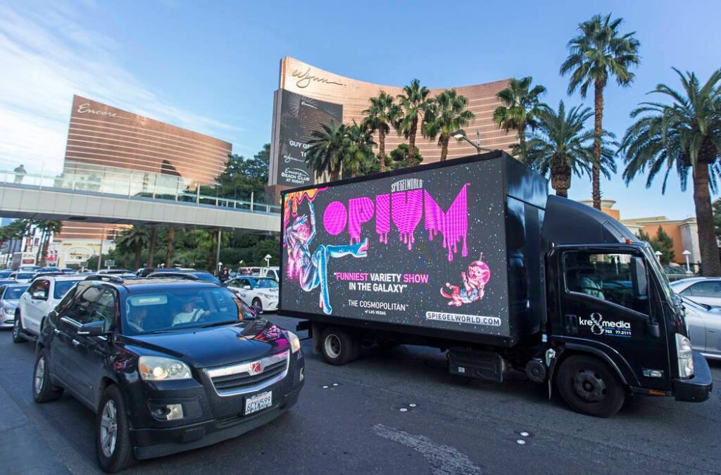  A Neon-Lighted Digital Mobile Billboard Along The Las Vegas Strip About A Variety Show In The Galaxy.